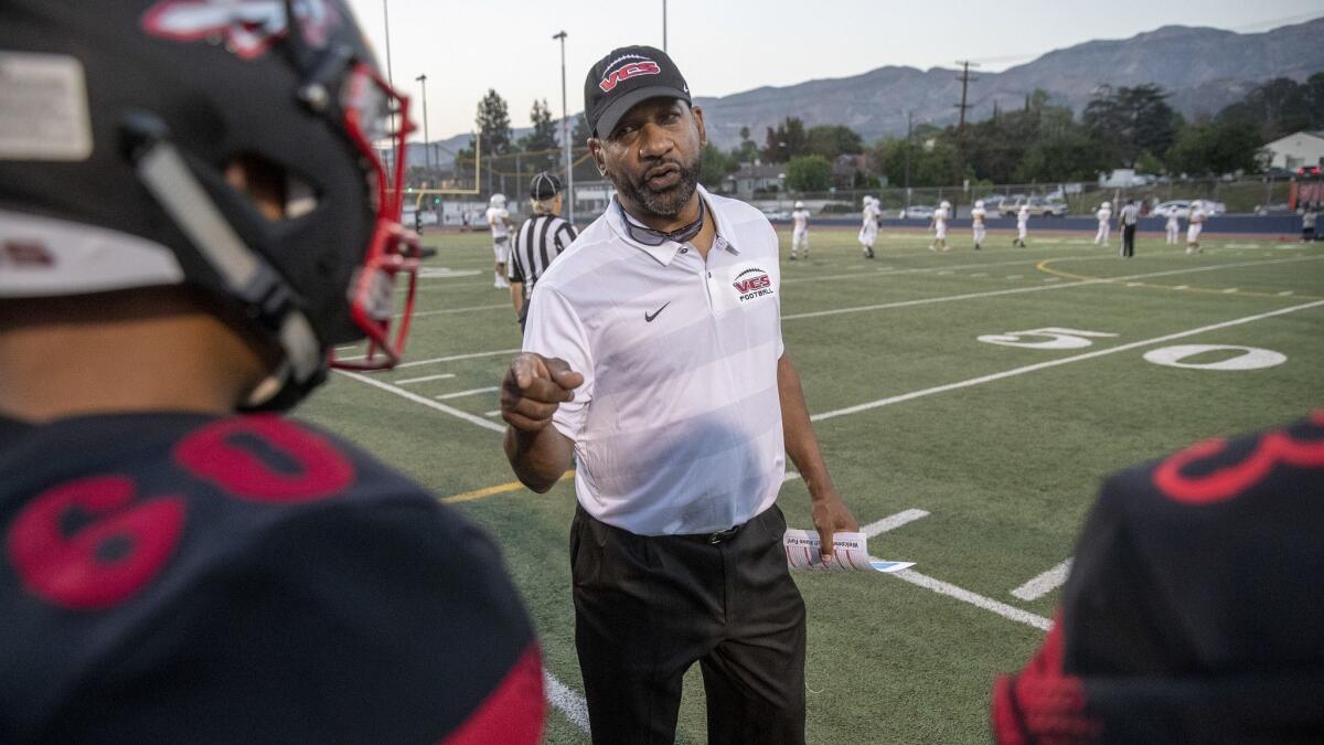 Former USC running backs coach Todd McNair on the football field at Burbank High with the Village Christian Crusaders in Burbank, on Aug. 17, 2018.
