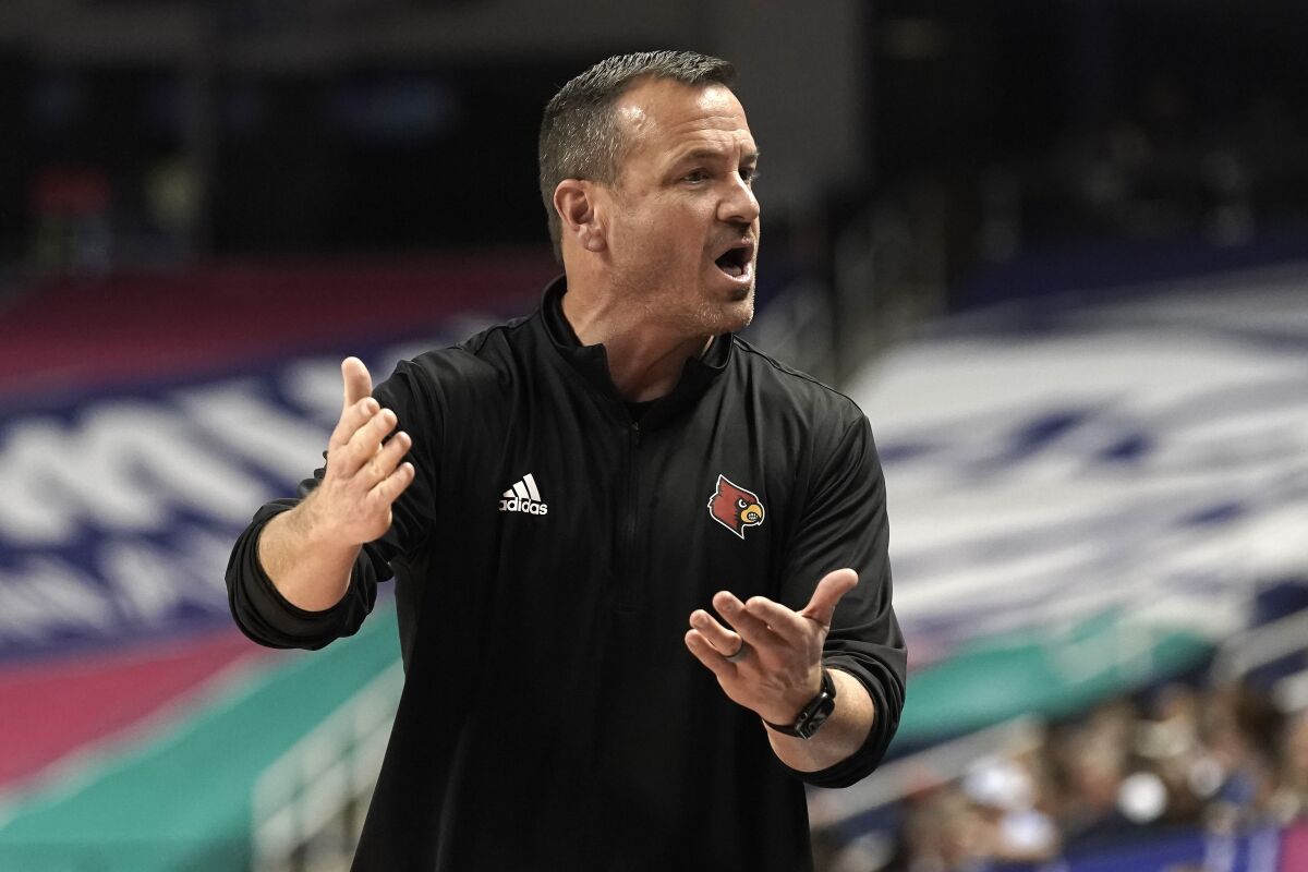 Louisville coach Jeff Walz reacts during the second half of the team's NCAA college basketball game against Miami in the quarterfinals of the Atlantic Coast Conference women's tournament in Greensboro, N.C., Friday, March 4, 2022. (AP Photo/Gerry Broome)