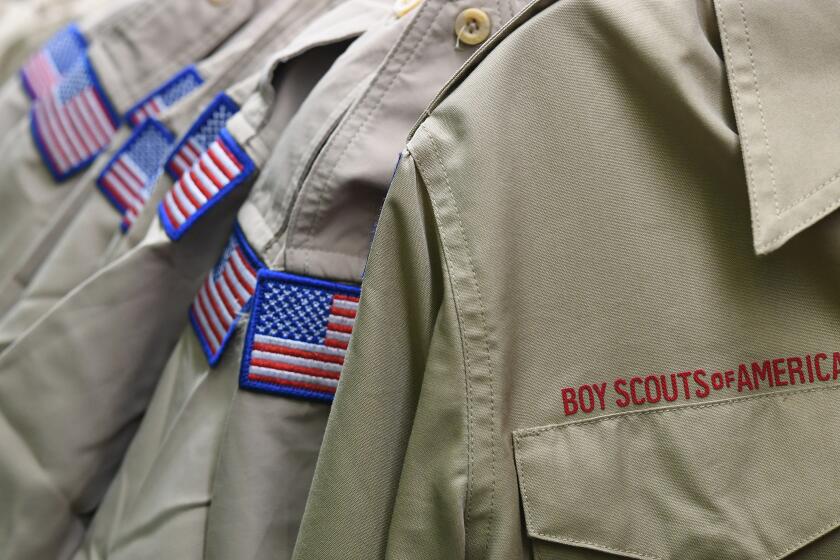 FILE - In this Feb. 18, 2020, file photo, Boy Scouts of America uniforms are displayed in the retail store at the headquarters for the French Creek Council of the Boy Scouts of America in Summit Township, Pa. Nine sex-abuse lawsuits were filed Tuesday, May 19 2020, in upstate New York against three Boy Scout local councils, signaling an escalation of efforts to pressure councils nationwide to pay a big share of an eventual settlement in the Scouts’ bankruptcy proceedings. The lawsuits were filed shortly after an easing of coronavirus lockdown rules enabled courts in some parts of New York to resume the handling of civil cases. (Christopher Millette/Erie Times-News via AP, File)