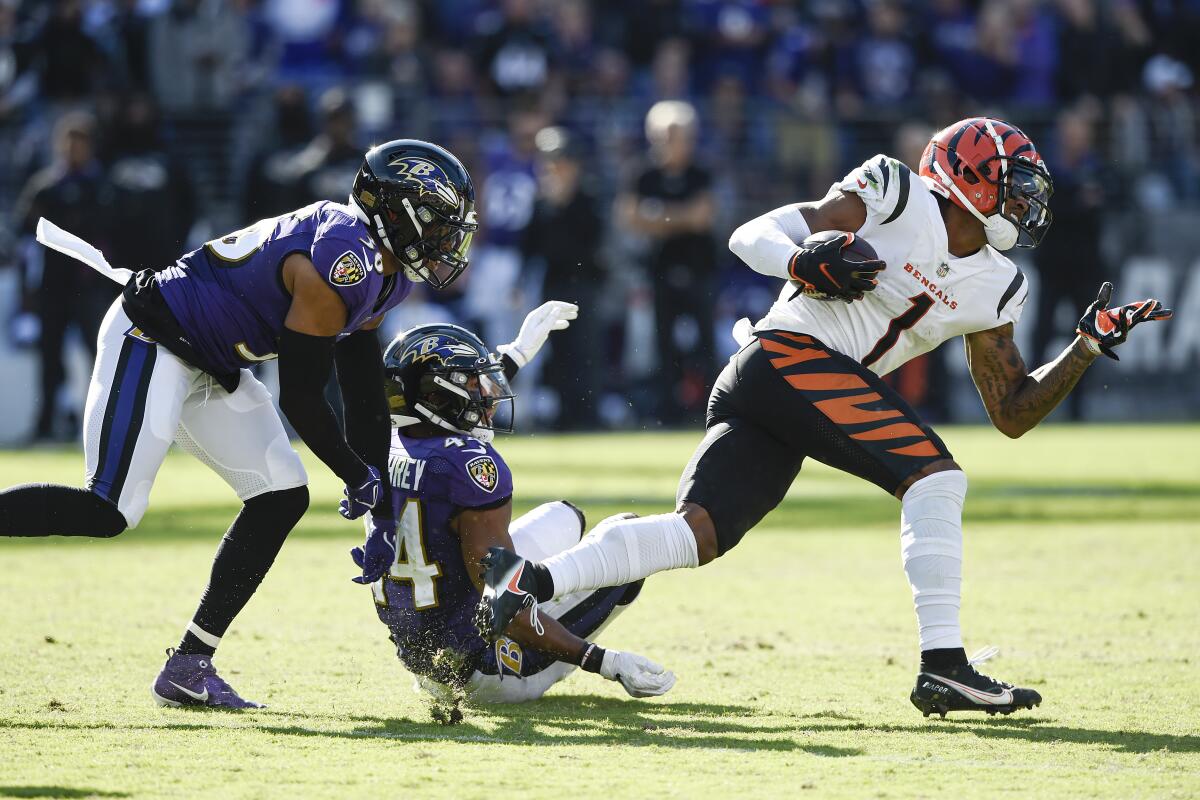 Lamar spreads ball around to new receivers in win over Bengals