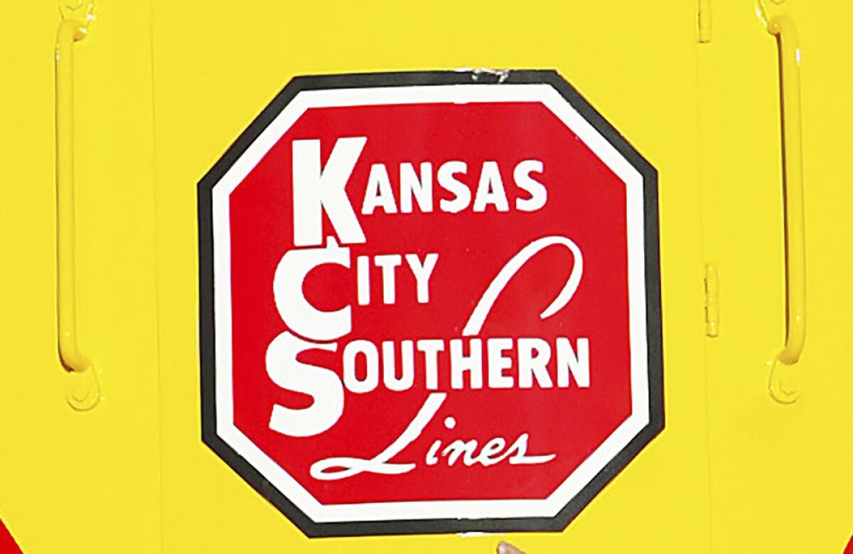 FILE - In this Nov. 5, 2004 file photo, the logo of Kansas City Southern is down on a restored 1954 Kansas City Southern passenger locomotive at Union Station in Kansas City, Mo. Canadian Pacific is increasing its offer for Kansas City Southern to approximately $31 billion as it looks to best rival Canadian National for the railroad. Canadian Pacific said Tuesday, Aug. 10, 2021 that its cash-and-stock proposal includes 2.884 Canadian Pacific common shares and $90 in cash for each share of Kansas City Southern stock held.(Norman Ng/The Kansas City Star via AP)