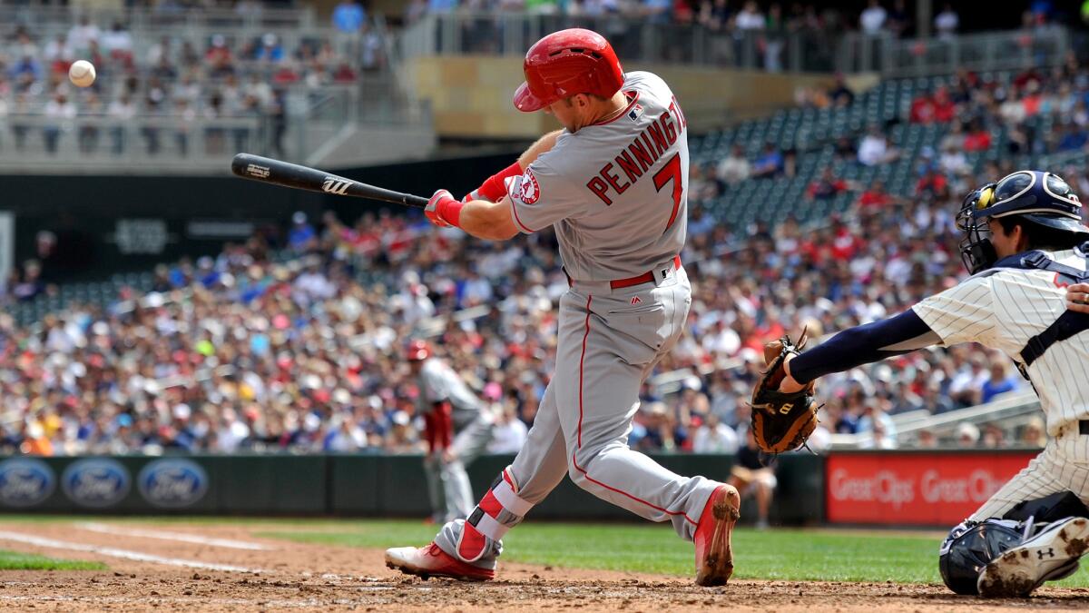 Angels second baseman Cliff Pennington connects for a two-run double against the Twins during the second inning Saturday.