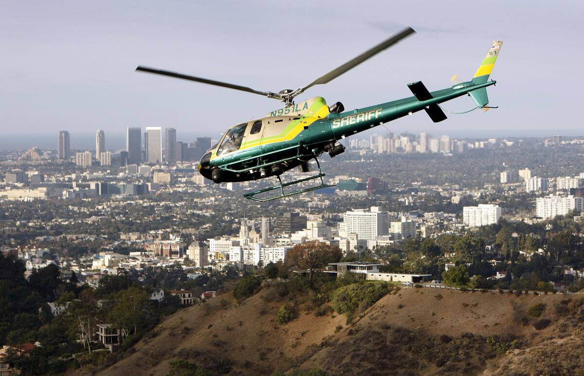 A Los Angeles County Sheriff's Department helicopter on assignment over Griffith Park in 2014.