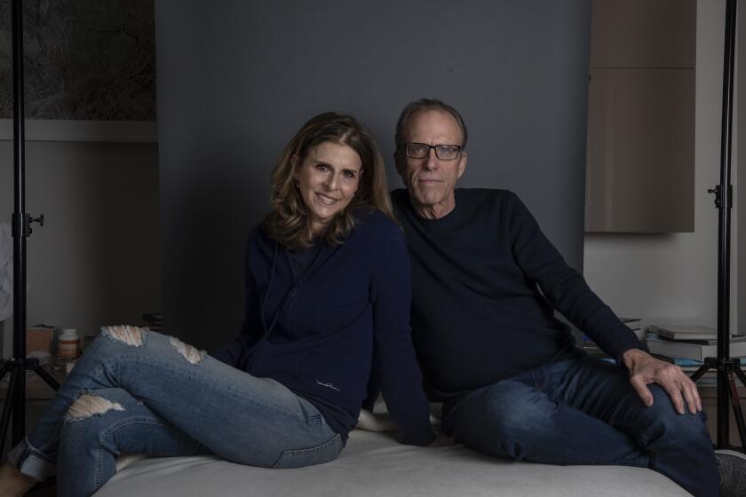 BRENTWOOD, CALIF. -- TUESDAY, JANUARY 14, 2020: Kirby Dick, right, and Amy Ziering, left, sit for portraits in Brentwood, Calif., on Jan. 14, 2020. The pair made a documentary that's about to premiere at Sundance. It was produced by Oprah and going to debut on Apple+. But last week, Oprah pulled her name from the film, and took it off the streaming platform. (Brian van der Brug / Los Angeles Times)