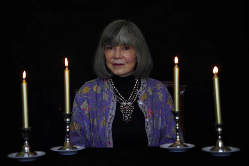 A woman surrounded by candles