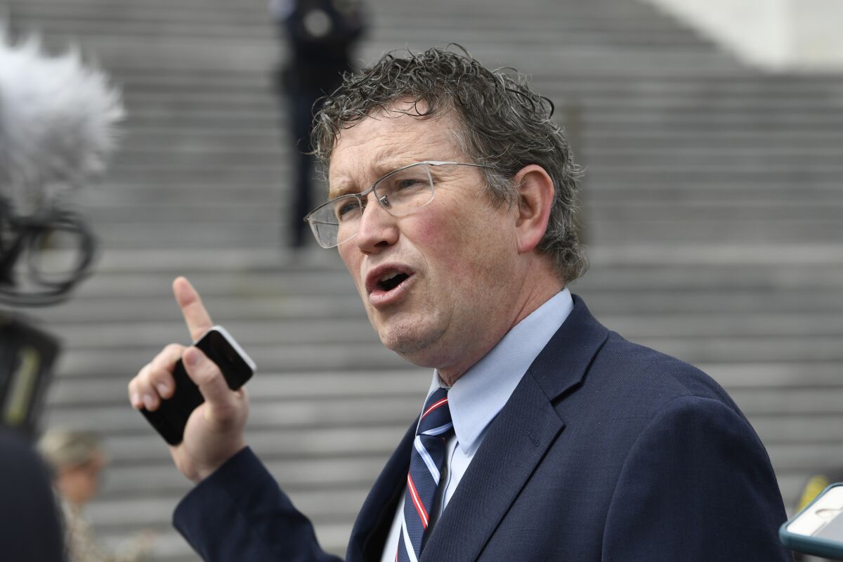 FILE - Rep. Thomas Massie, R-Ky., talks to reporters before leaving Capitol Hill in Washington, March 27, 2020. Massie is back in Donald Trump's good graces. The Kentucky congressman won the former president's endorsement Tuesday, May 10, 2022 ahead of next week's primary election. Just two years ago, Trump said the maverick congressman should be thrown out of the Republican Party. Now the former president is calling Massie a “Conservative Warrior” and a "first-rate Defender of the Constitution.” (AP Photo/Susan Walsh, File)