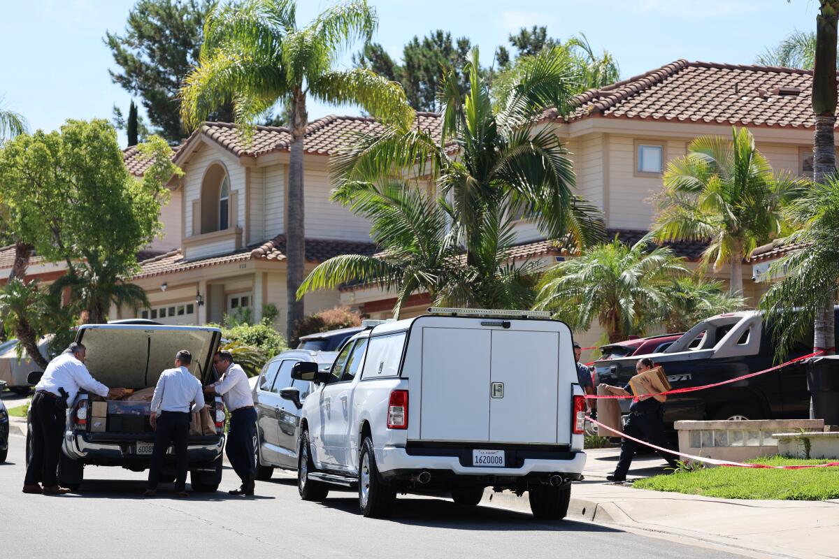 Investigators remove evidence from the home of Orange County Superior Court Judge Jeffrey Ferguson.