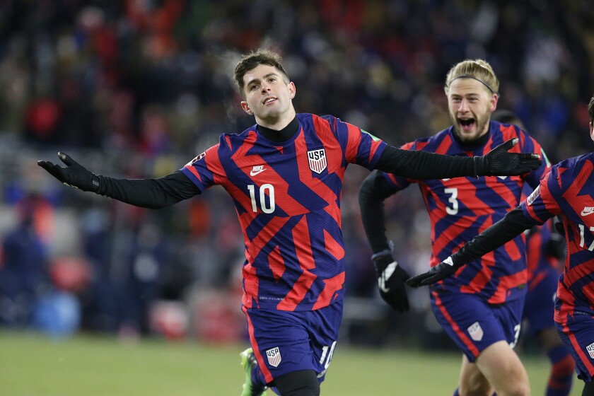 United States' Christian Pulisic (10) celebrates his goal with Walker Zimmerman (3) during the second half of the team's FIFA World Cup qualifying soccer match against Honduras, Wednesday, Feb. 2, 2022, in St. Paul, Minn. (AP Photo/Andy Clayton-King)