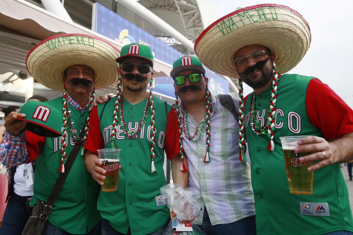 ZAPOPAN, MEXICO - MARCH 09: Fans of Mexico pose for pictures before the World Baseball Classic Pool D Game 1 between Italy and Mexico at Panamericano Stadium on March 09, 2017 in Zapopan, Mexico. (Photo by Miguel Tovar/Getty Images) ** OUTS - ELSENT, FPG, CM - OUTS * NM, PH, VA if sourced by CT, LA or MoD **