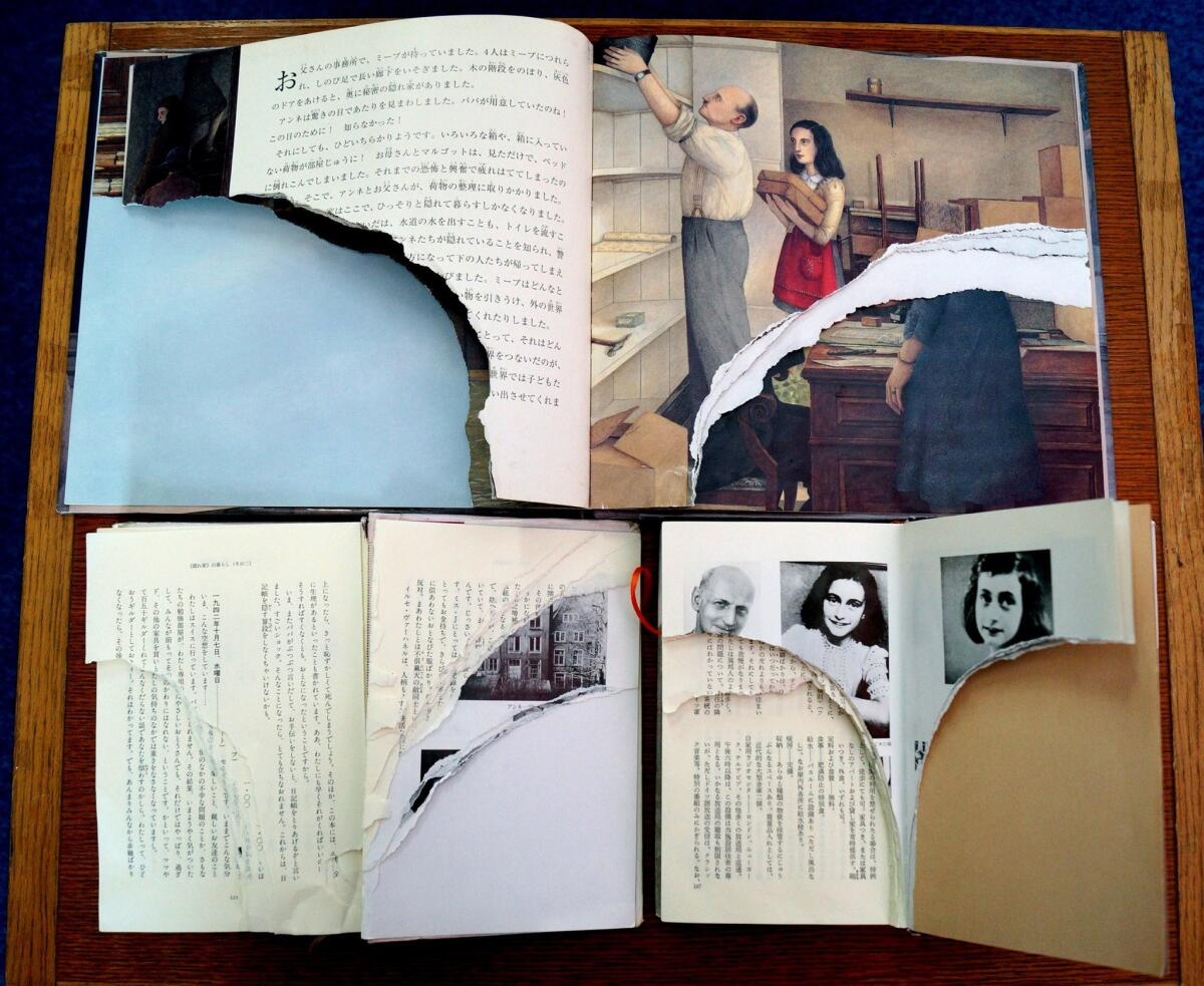 Three copies of Anne Frank's "The Diary of a Young Girl" with pages ripped out at a library in Tokyo.
