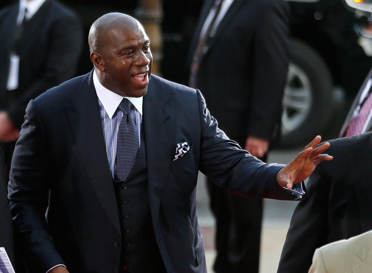 Former Lakers star Magic Johnson will set foot in the Forum on Sunday for the first time since the arena reopened in January.