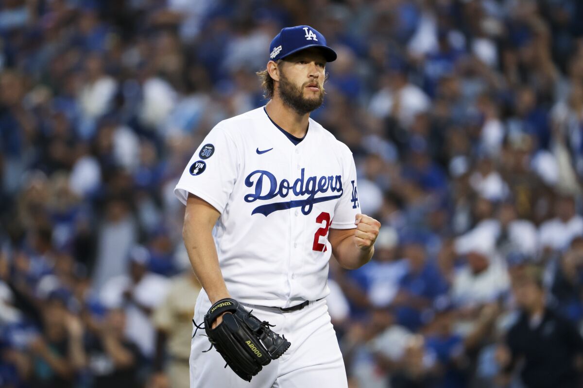 Dodgers pitcher Clayton Kershaw celebrates a strikeout against the San Diego Padres in the playoffs on Oct. 12, 2022.