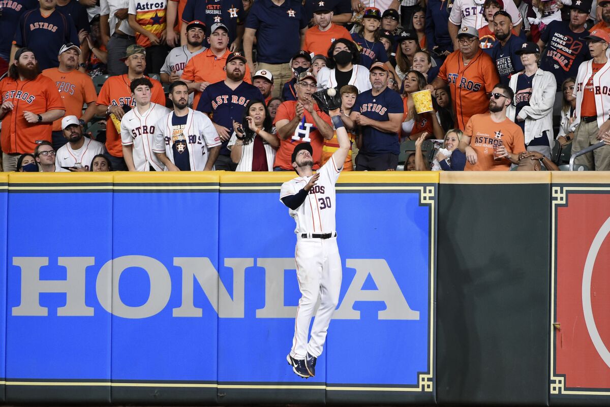 Houston Astros right fielder Kyle Tucker (30) catches the fly ball of Oakland Athletics' Tony Kemp to end the top of the sixth inning of a baseball game, Saturday, Oct. 2, 2021, in Houston. (AP Photo/Eric Christian Smith)