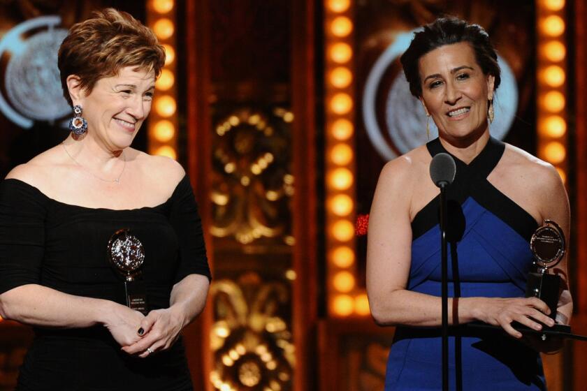 Lisa Kron, left, and Jeanine Tesori accept the award for best score for "Fun Home" during the 69th Tony Awards at New York's Radio City Music Hall on Sunday.