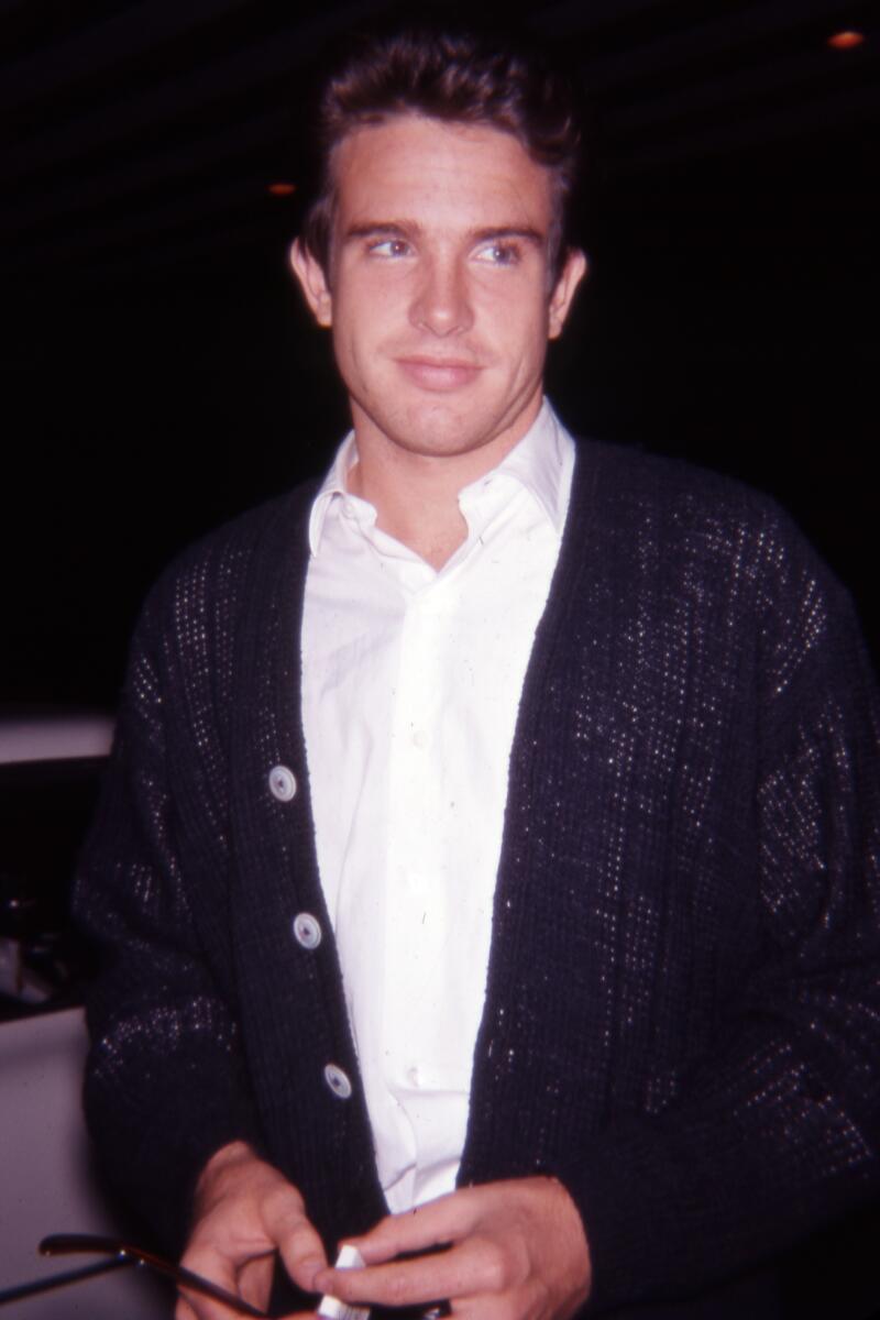 Warren Beatty next to a car in a parking lot. The date handwritten on the slide is October 28, 1961. (Photograph by Jon Verzi) (ONE TIME USE)