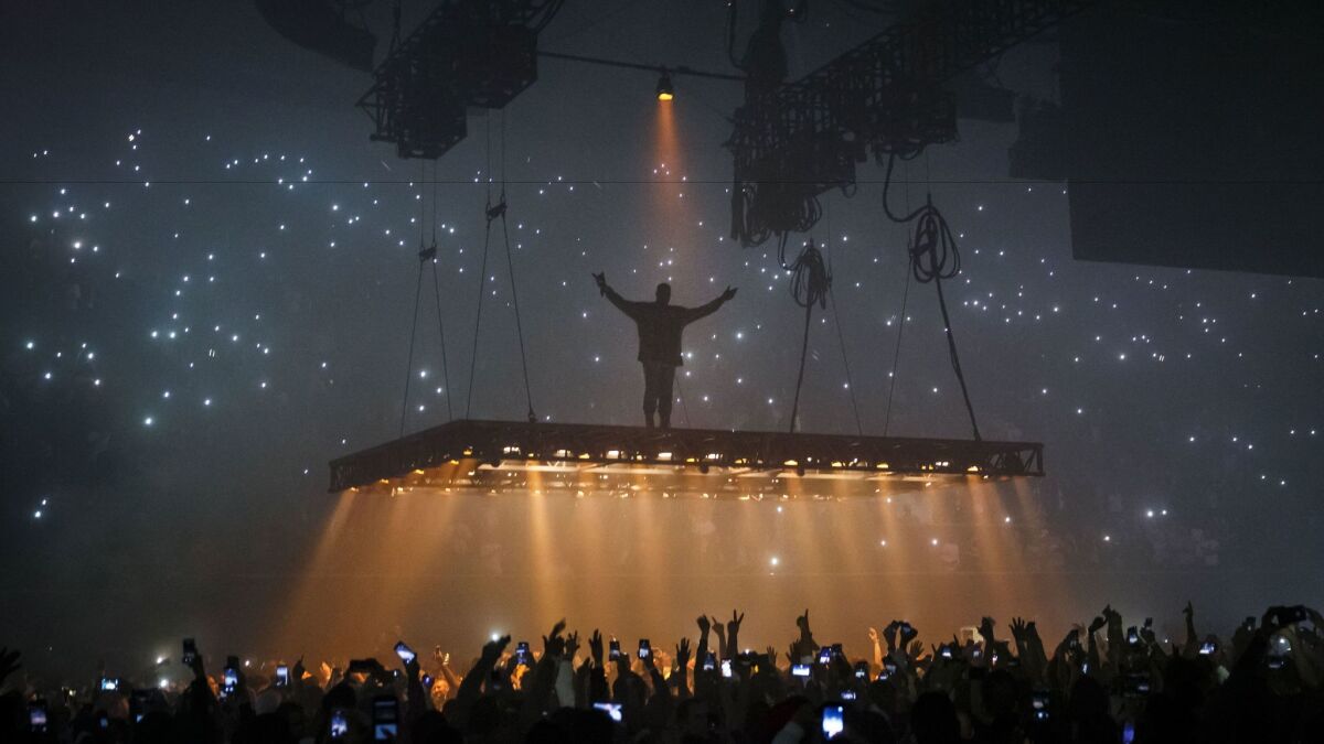 Kanye West hovers above the crowd at the Forum on Oct. 25.