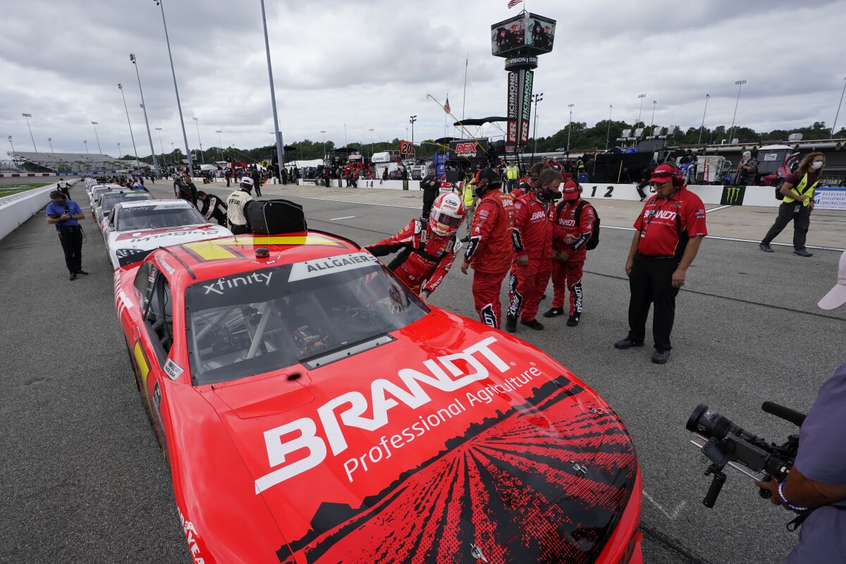 CORRECTS DATE TO SEPT. 12-Winner of last night's Xfinity race Justin Allgaier (7) gets in his car prior to the start of a NASCAR Xfinity Series auto race Saturday, Sept. 12, 2020, in Richmond, Va. (AP Photo/Steve Helber)