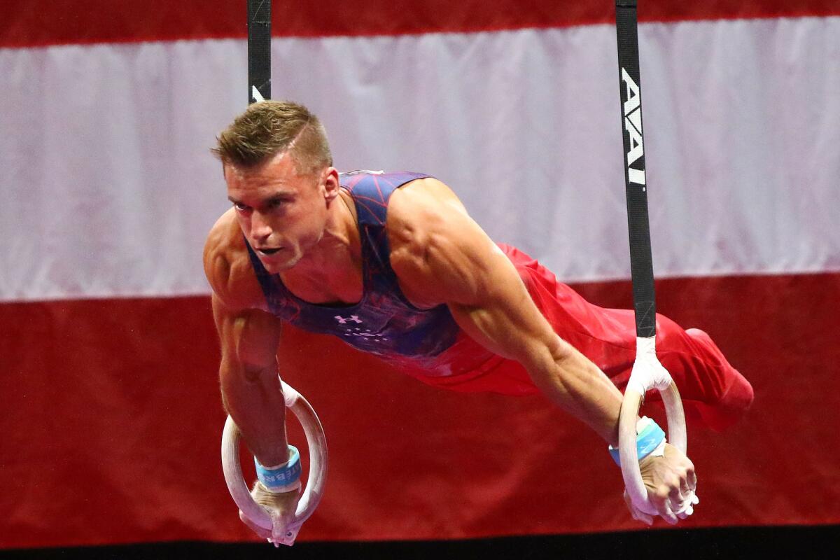 Sam Mikulak competes on the rings during day one of the 2016 men's gymnastics U.S. Olympic Trials.