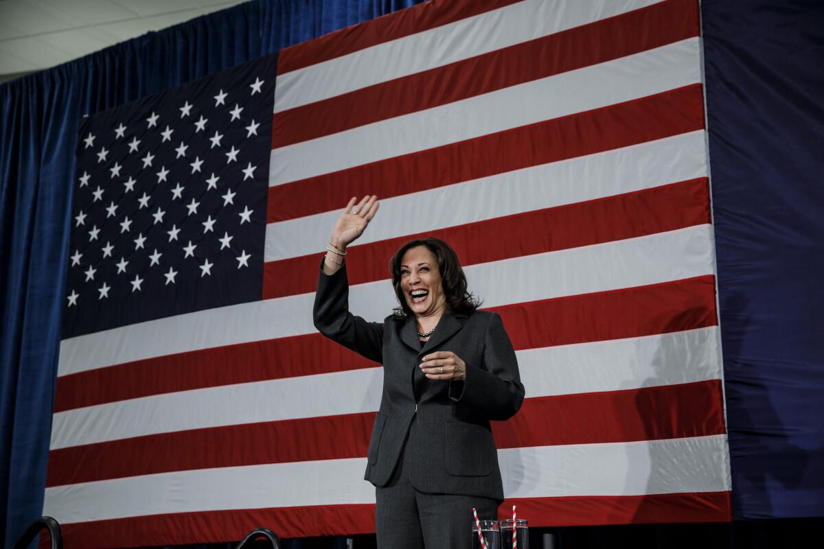 Sen. Kamala Harris greets the crowd at a campaign rally at the FFA Enrichment Center in Ankeny, Iowa, on Feb. 23. 