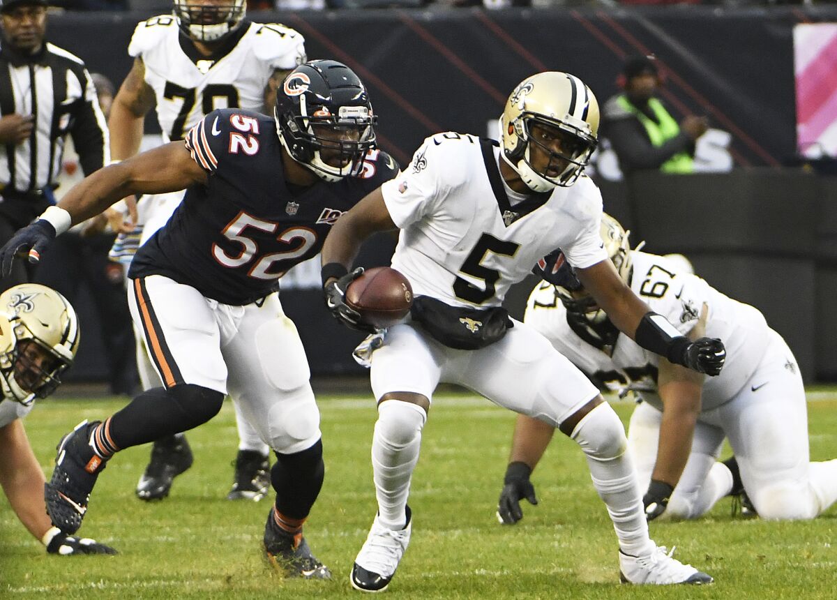 Chicago Bears defensive lineman Khalil Mack tries to tackle New Orleans Saints quarterback Teddy Bridgewater during Sunday's game.