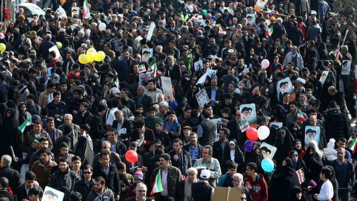 Iranians attend a rally marking the 39th anniversary of the 1979 Islamic Revolution, in Tehran on Sunday, Feb. 11, 2018.