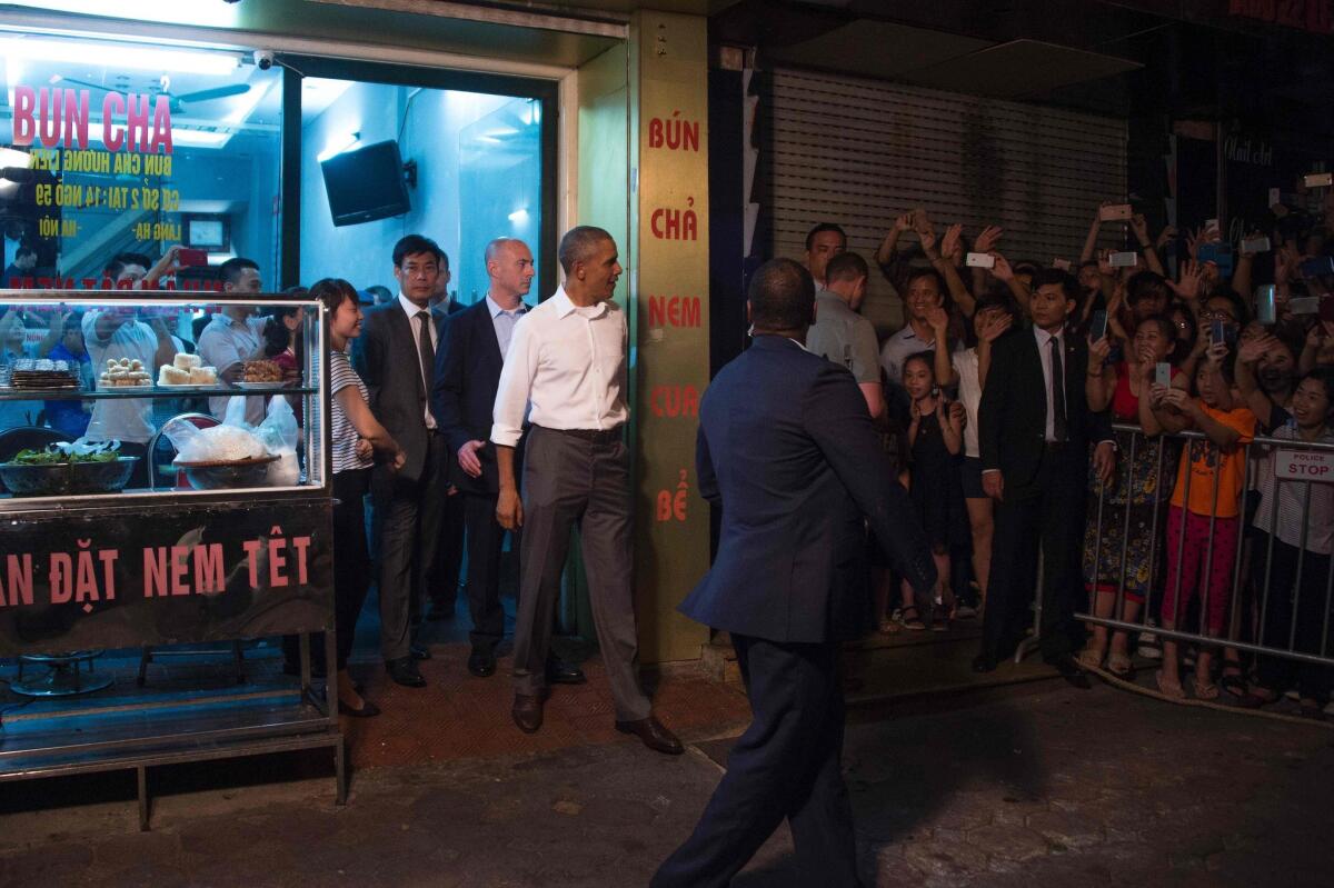 President Obama departs after eating dinner at Bun cha Huong Lien with CNN's Anthony Bourdain in Hanoi late on May 23, 2016.