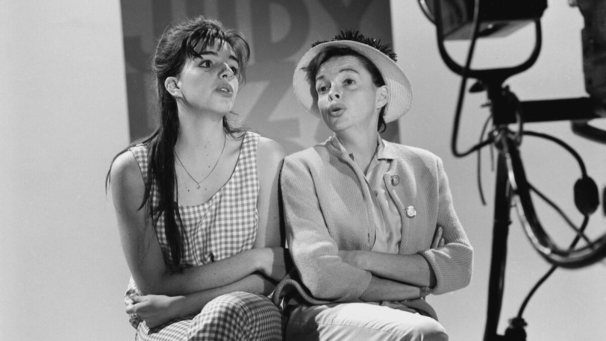 Judy Garland, right, rehearses with daughter Liza Minnelli on the set of her musical variety series, "The Judy Garland Show," on July 15, 1963.