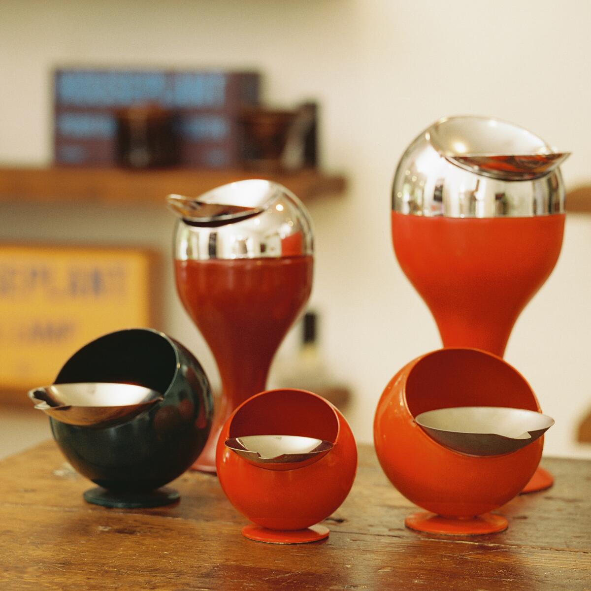 Five colorful, orb-shaped ashtrays.