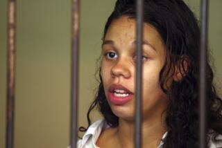FIOLE - Heather Mack from Chicago, Ill., stands inside a cell before a trial in Bali, Indonesia, Wednesday, March 11, 2015. Federal prosecutors in Chicago are recommending a 28-year prison sentence for Mack, an American woman who pleaded guilty to helping kill her mother and stuff the body in a suitcase during a luxury vacation at a Bali resort nearly a decade ago. (AP Photo/Firdia Lisnawati, File)