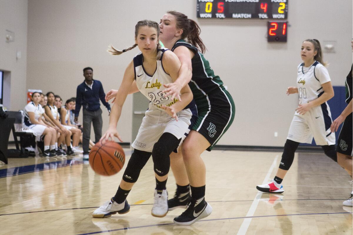 Newport Christian's Abbi Bowman dribbles past Brethren Christian's defense in a nonleague game on Thursday in Newport Beach.