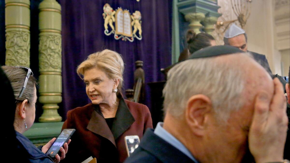 Rep. Carolyn Maloney, center, a New York Democrat and member of Congress' bipartisan task force on anti-Semitism, speaks at the Park East Synagogue in New York in March after a news conference to address threats against Jewish organizations and vandalism at Jewish cemeteries.