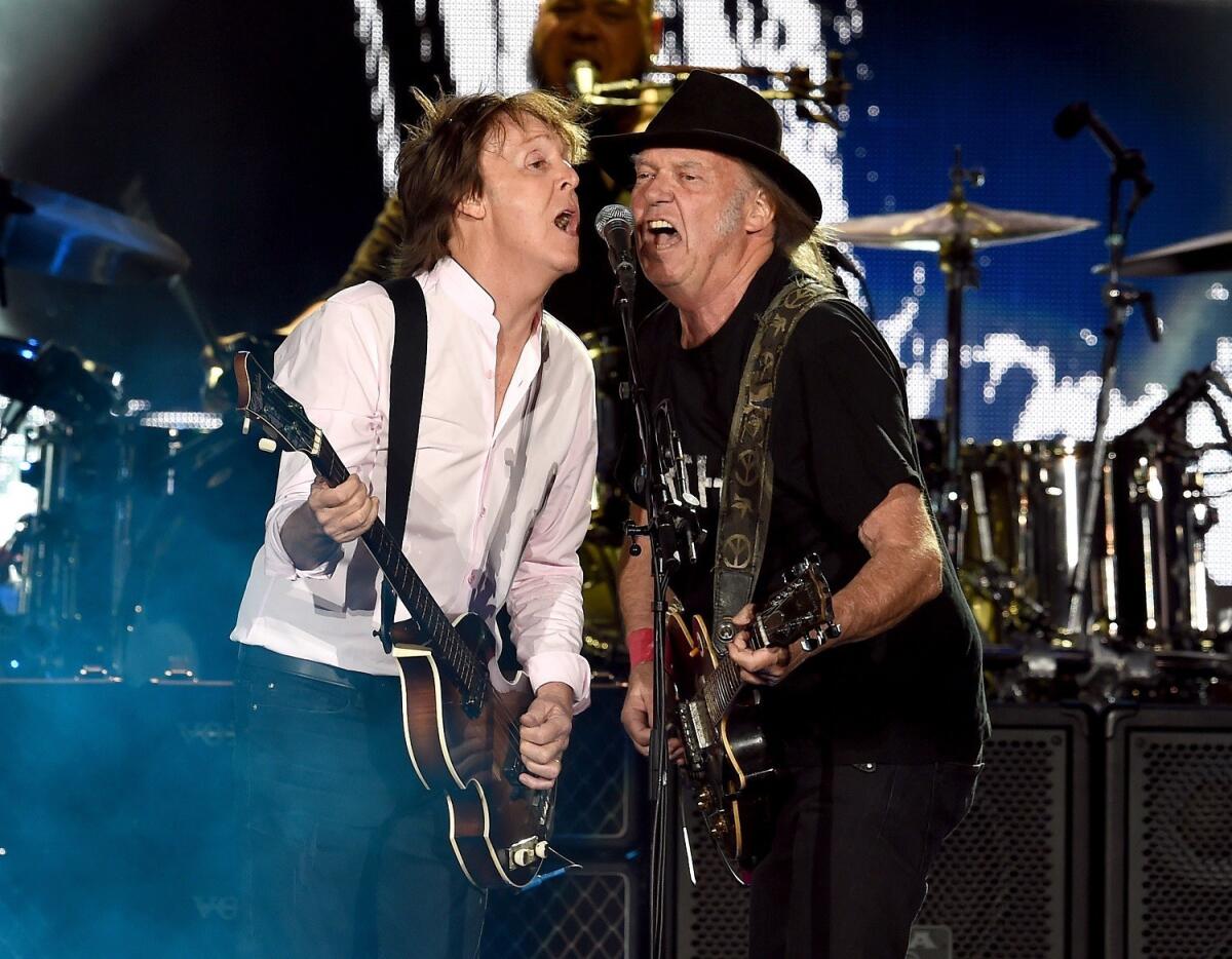 Sir Paul McCartney and Neil Young perform onstage during Desert Trip at the Empire Polo Field on Oct. 8 in Indio. (Kevin Winter / Getty Images)