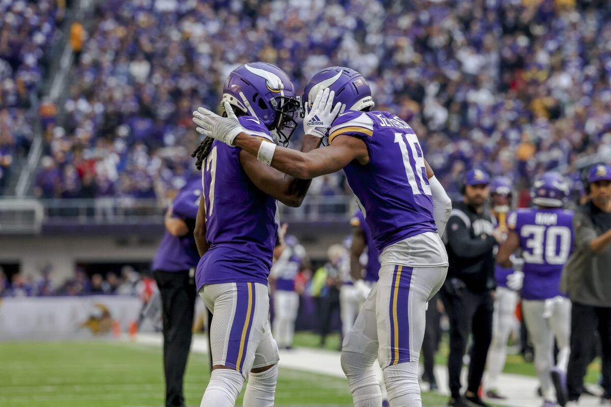 Minnesota Vikings wide receiver K.J. Osborn celebrates with wide receiver Justin Jefferson after a touchdown.