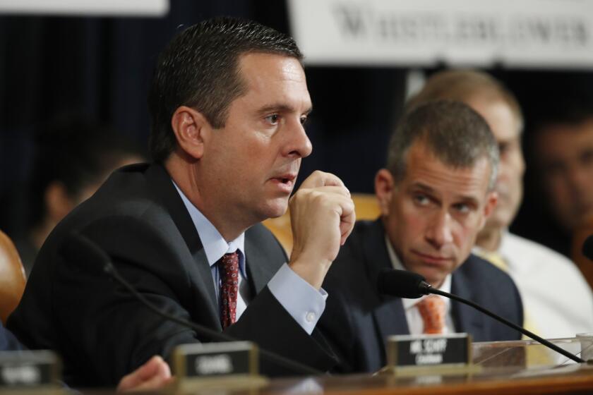 Ranking member Rep. Devin Nunes, R-Calif., left, questions the witness as Steve Castor, Republican staff attorney for the House Oversight Committee looks on, as former Ambassador to Ukraine Marie Yovanovitch testifies before the House Intelligence Committee on Capitol Hill in Washington, Friday, Nov. 15, 2019, during the second public impeachment hearing of President Donald Trump's efforts to tie U.S. aid for Ukraine to investigations of his political opponents. (AP Photo/Alex Brandon)