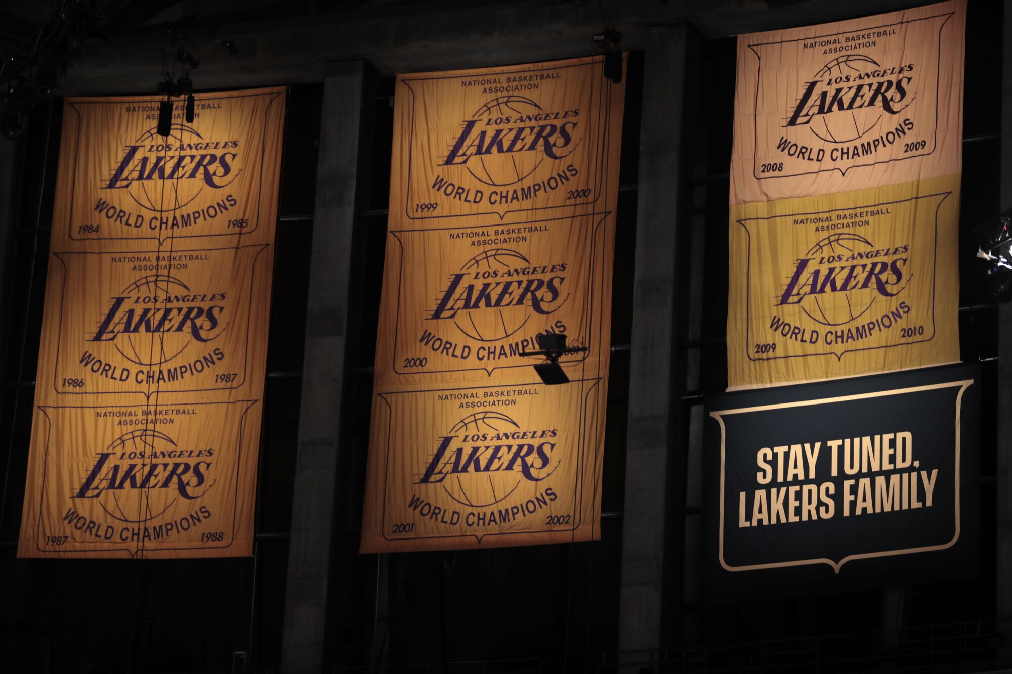 A banner telling Lakers fans to "stay tuned" hangs as a placeholder for the team's 2020 championship.