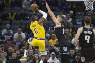 Los Angeles Lakers forward LeBron James (6) shoots over Sacramento Kings forward Domantas Sabonis (10) during the first quarter of an NBA basketball game in Sacramento, Calif., Wednesday, Dec. 21, 2022. (AP Photo/José Luis Villegas)