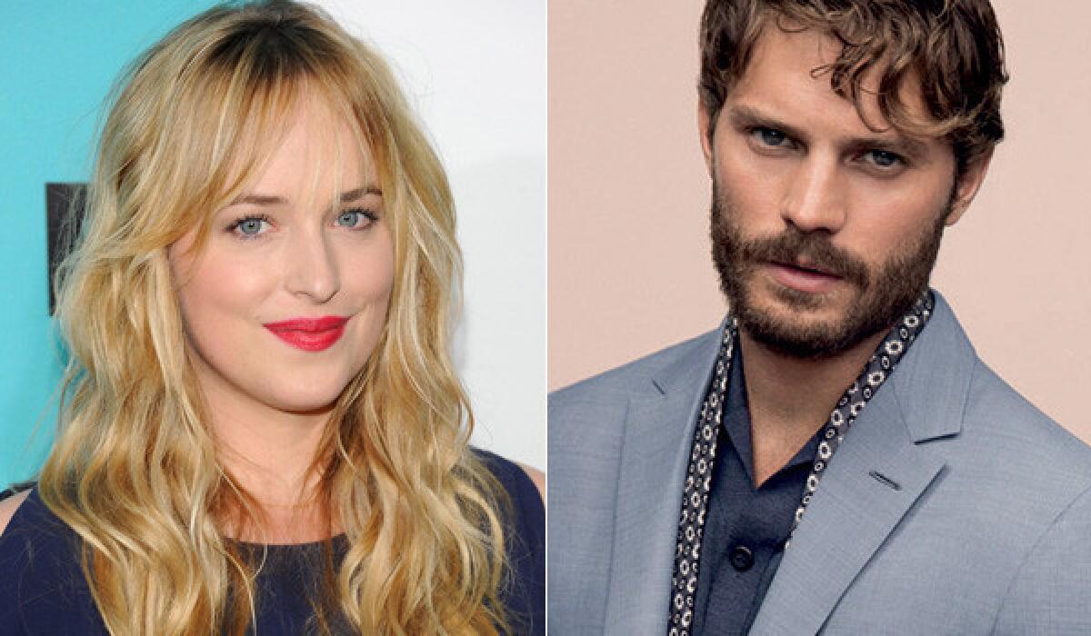 Dakota Johnson, left, stars with Jamie Dornan in "Fifty Shades of Grey," which was previewed for the first time at CinemaCon on Tuesday.