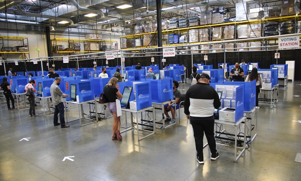 Voters cast their votes in 2020 election in San Diego County Registrar of Voters headquarters. 