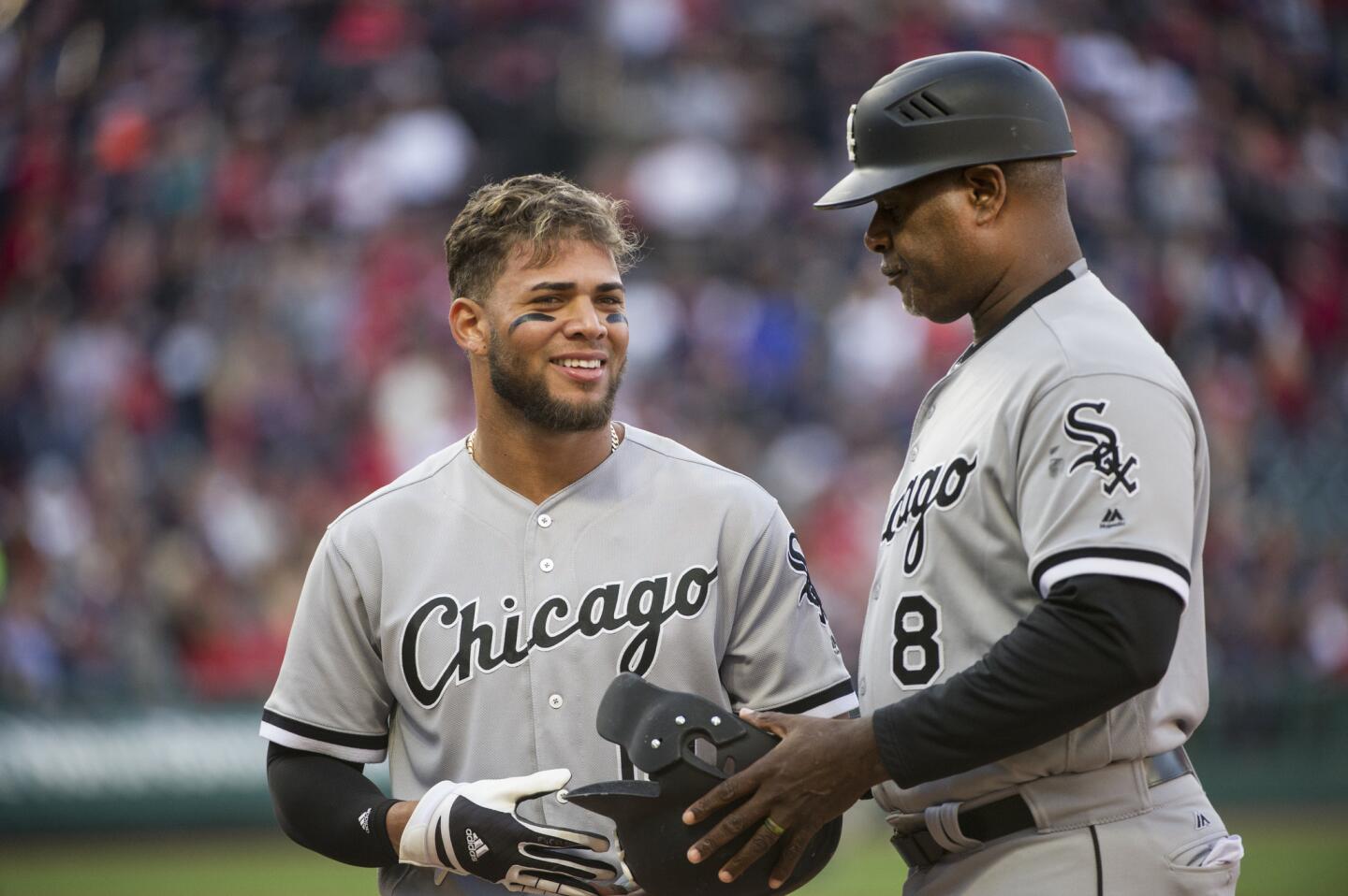 White Sox second baseman Yoan Moncada talks with first base coach Daryl Boston during a game against the Indians in Cleveland, Sunday, Oct. 1, 2017.
