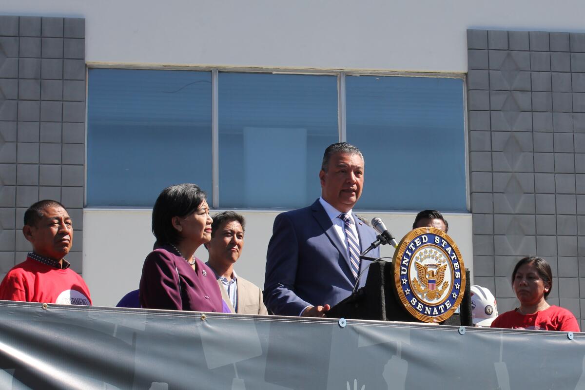 Sen. Alex Padilla and Rep. Judy Chu at a news conference with union workers.