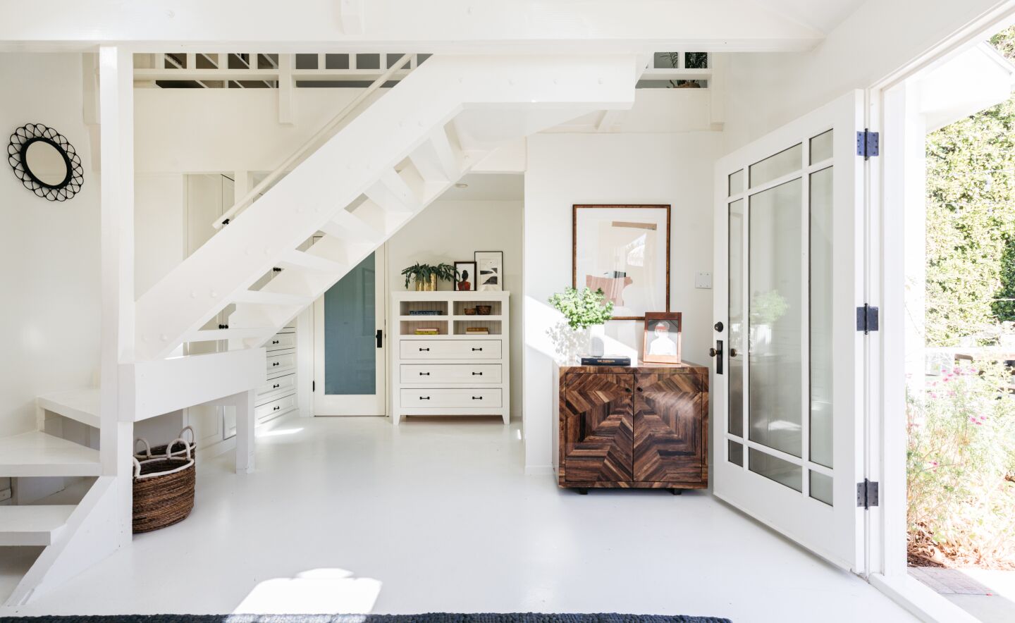 White walls, floors and staircase.