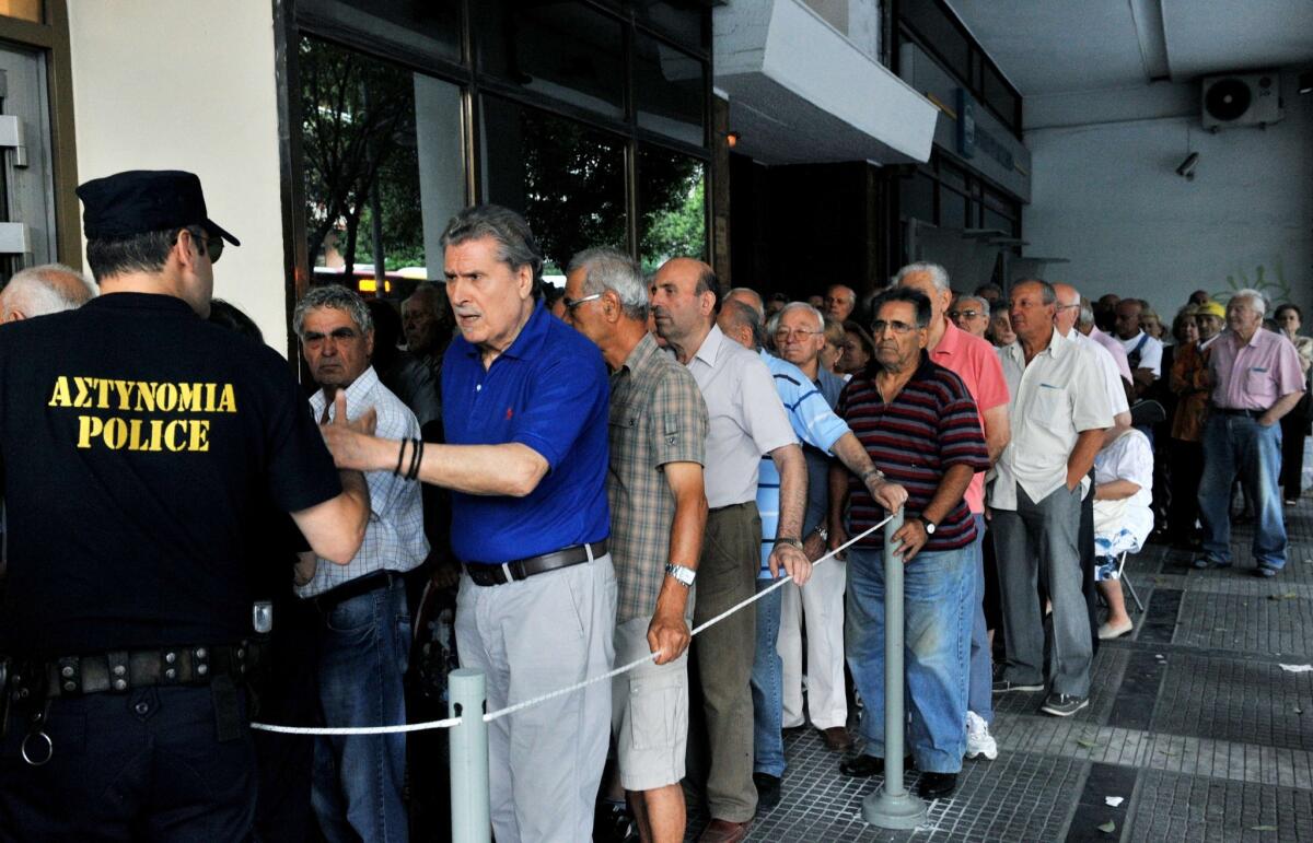 Long lines of Greeks gather daily at ATMs where depositors have access to only 60 euros -- $67 -- of their money each day.
