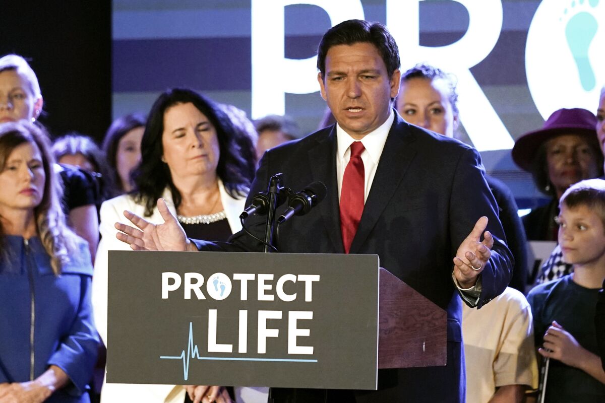 Florida Gov. Ron DeSantis speaks to supporters before signing a 15-week abortion ban into law Thursday, April 14, 2022, in Kissimmee, Fla. The move comes amid a growing conservative push to restrict abortion ahead of a U.S. Supreme Court decision that could limit access to the procedure nationwide. (AP Photo/John Raoux)
