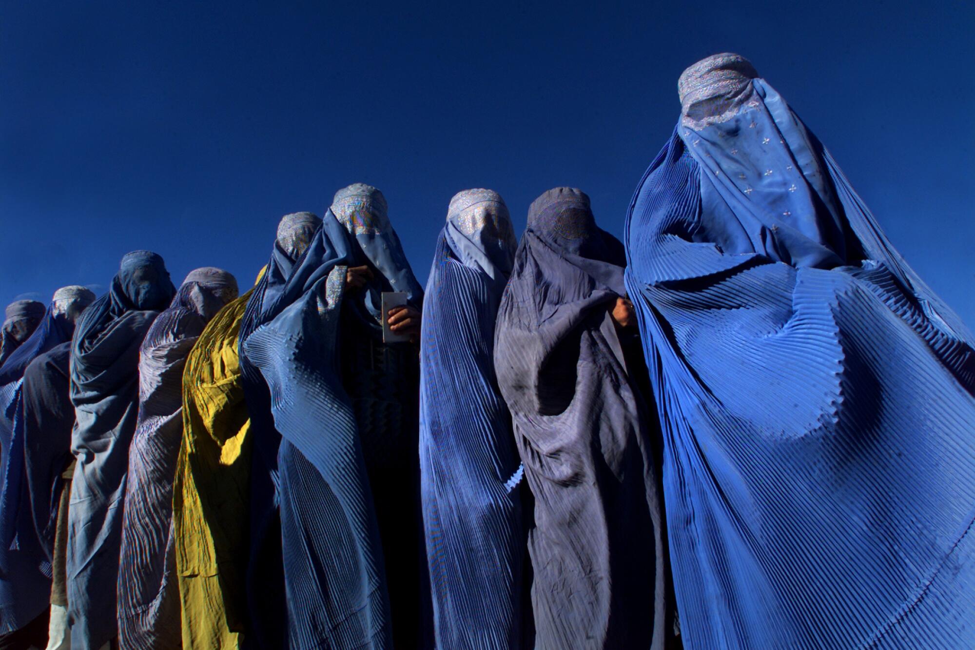 A line of women in full burqas
