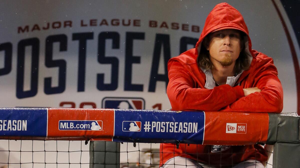 Angels pitcher Jered Weaver looks on from the dugout during the team's season-ending loss to the Kansas City Royals on Sunday.