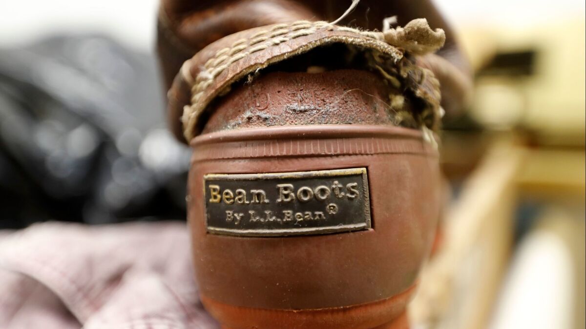 A duck boot in the return bin at an L.L. Bean retail store in Freeport, Maine. Although the company is changing its return policy, it says it will always accept returns on products that have failed, such as this boot.