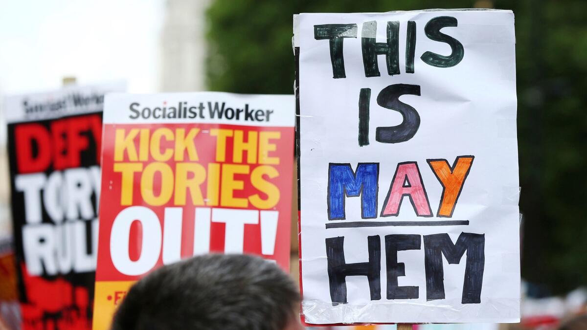 Protesters gather in Whitehall, London, to protest the Conservative government June 17 after the fire at Grenfell Tower.