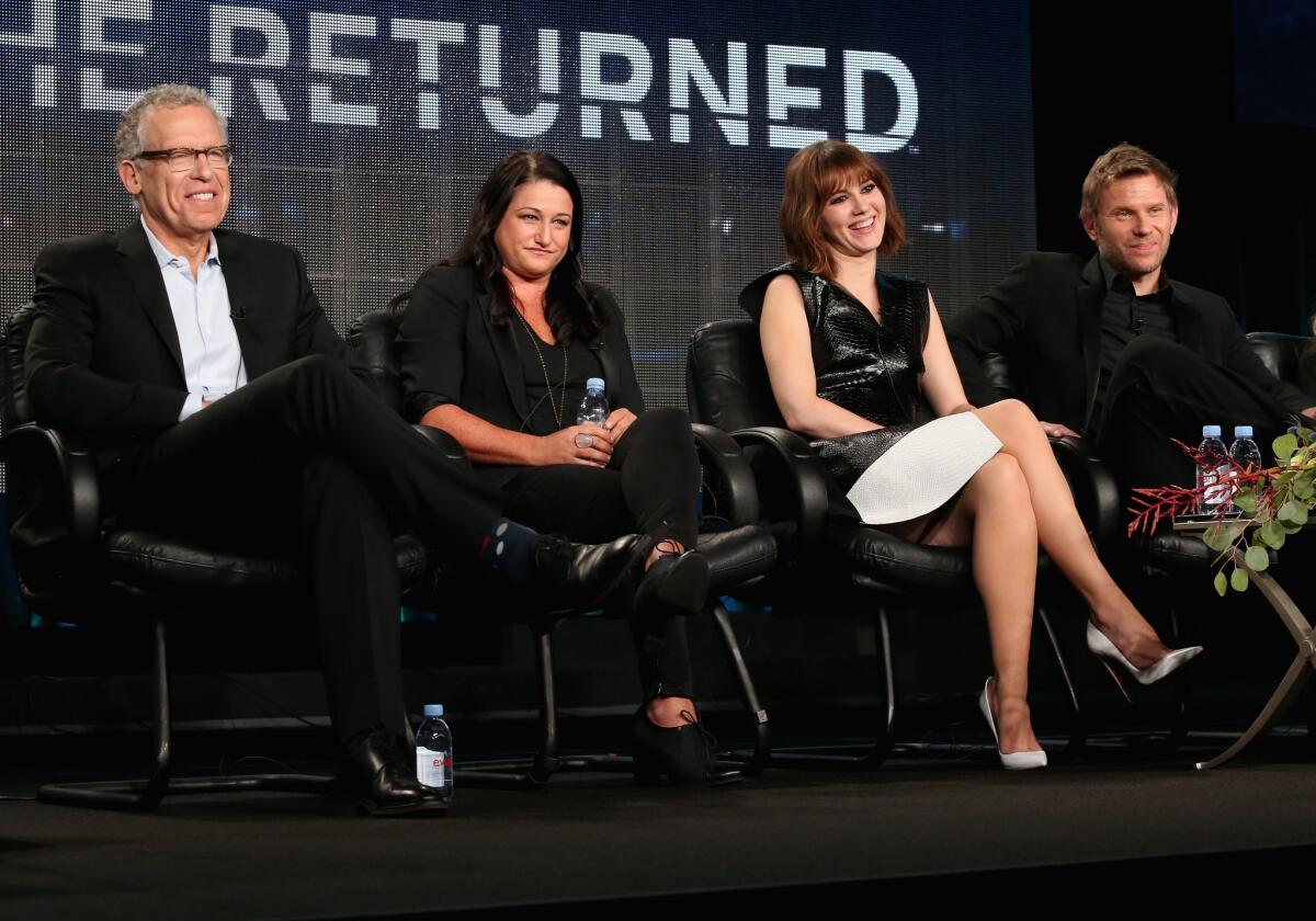 Executive producers Carlton Cuse and Raelle Tucker, actors Mary Elizabeth Winstead and Mark Pellegrino speak onstage during "The Returned" panel at A&E's part of the 2015 Winter Television Critics Assn. press tour Friday in Pasadena.