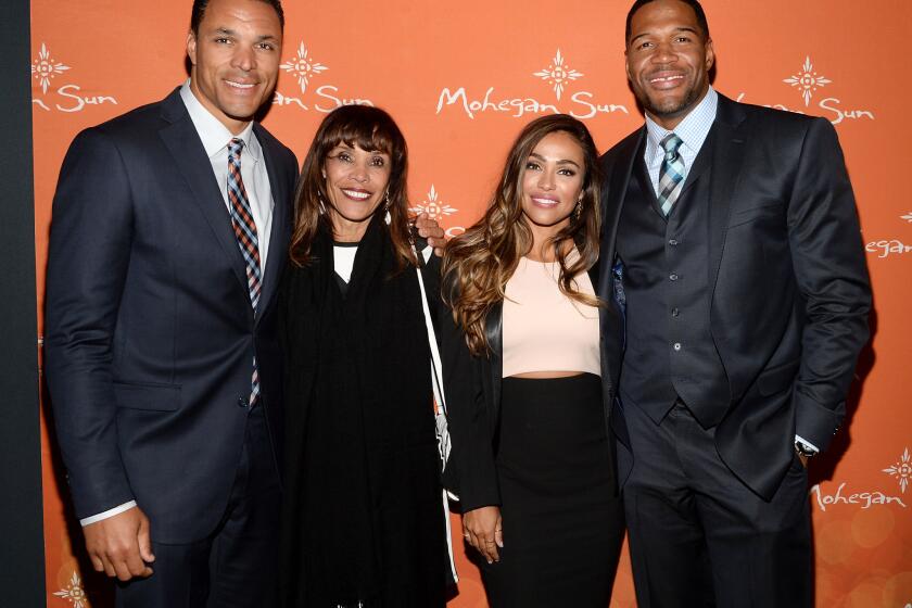 From left: Tony Gonzalez, Judy Gonzalez, October Gonzalez and executive producer Michael Strahan attend the 2015 Tribeca/ESPN Sports Film Festival Gala.