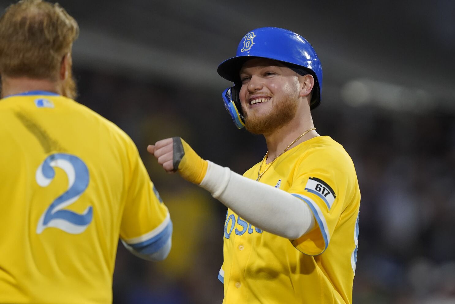 Why are the Boston Red Sox wearing yellow and blue uniforms today?